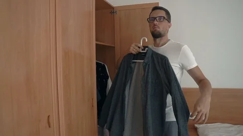 Man choosing shirt. Stock Footage 101522632