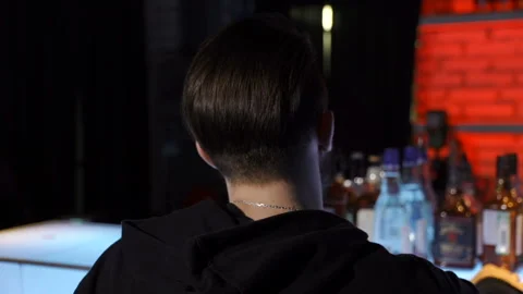 Man is choosing the whiskey Stock Footage 86259555