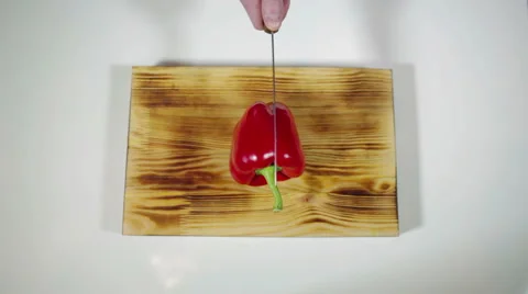 Man chopped red bell pepper on a cutting board Stock Footage 62400033