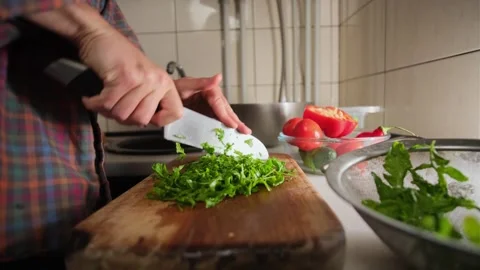 Man chopping arugula timelapse close up lifestyle healthy salad preparation in Video stock 316404210