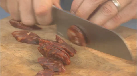 Man chopping chorizo Stock Footage 39588673