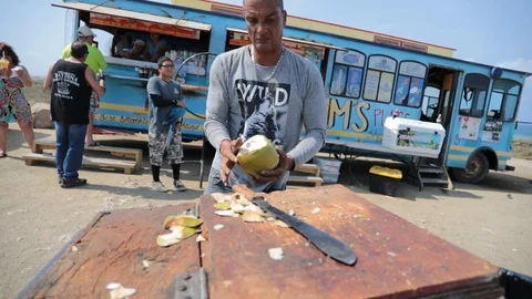 Man Chopping Coconut With Machete Stock Footage 92329232