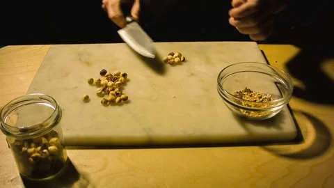 Man chopping hazelnut nuts. 스톡 동영상 79866839