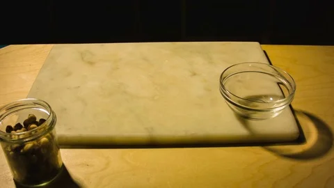 Man chopping hazelnut nuts. Video stock 79867317