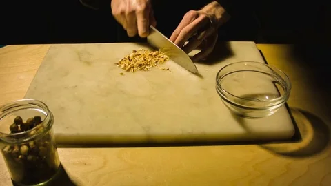 Man chopping hazelnut nuts. Stock-Footage 79870679