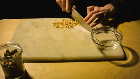 Man chopping hazelnut nuts. Stock-Footage 79873546