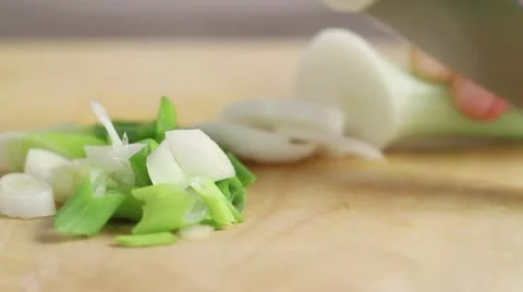 Man chopping leek, close-up Stock Footage 24654699