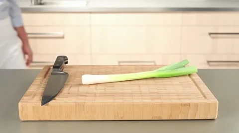 Man chopping leek, close-up Stock Footage 24672872