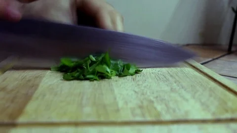 Man chopping parsley Stock Footage 76662392