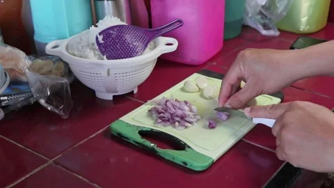 A man is chopping shallots Stock Footage 242569880