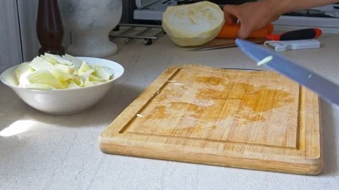 Man chopping vegetables Stock Footage 76586012