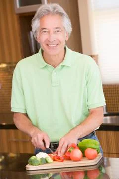 Man chopping vegetables Stock Photos