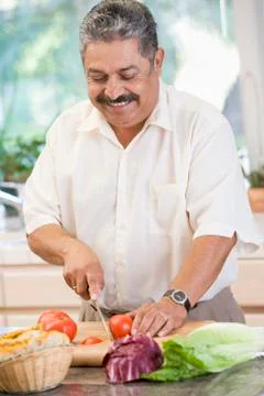 Man chopping vegetables Stock Photos