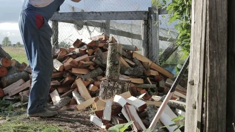 Man chopping wood In slow motion Stock Footage
