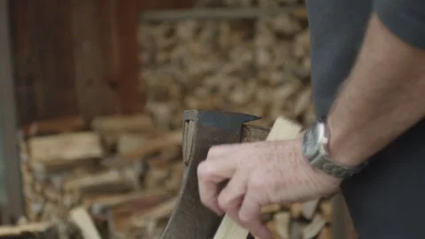 Man Chopping Woods With An Axe. Pile Of Firewood. Chopped And Stacked Wood Stock Footage 265086913