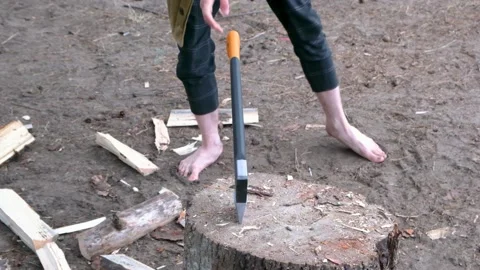 A man chops wood with an axe. Slow motion Stock Footage 202717600