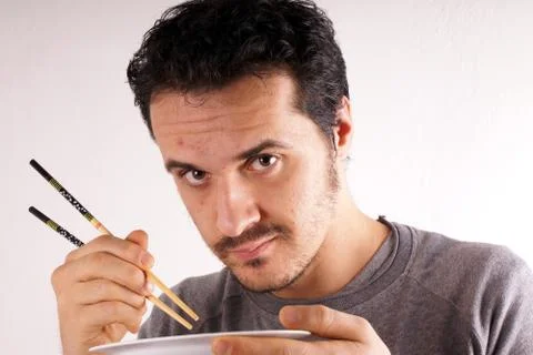 Man with chopstick Stock Photos