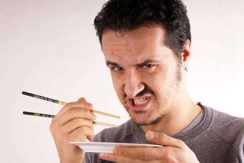 Man with chopstick Stock Photos