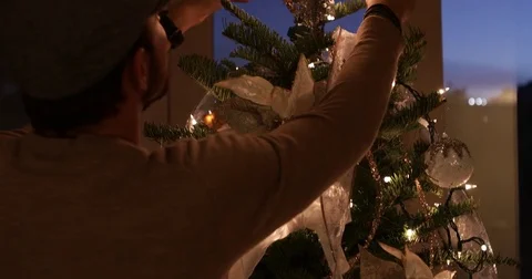 Man Christmas Tree Decorating Stock Footage 83100794