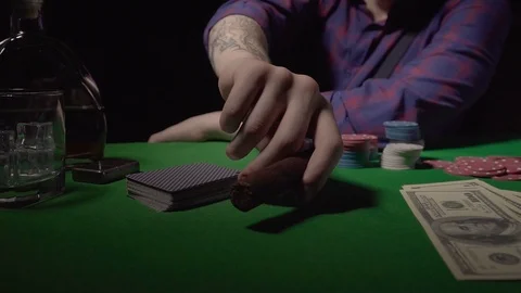 A man with a cigar at the card table Stock Footage 123045120