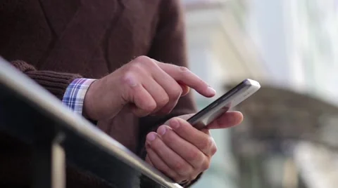 Man in the City Typing on Smartphone Stock Footage 63546653