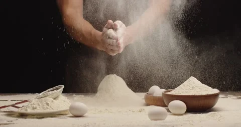 The man clapped his hands and shook the flour Stock Footage 170089726
