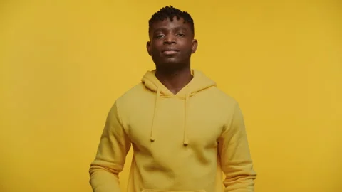 Man with Clapperboard on Yellow Background Stock Footage 273083841