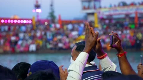 A man clapping during Ganga Aarti Stock Footage 214320398