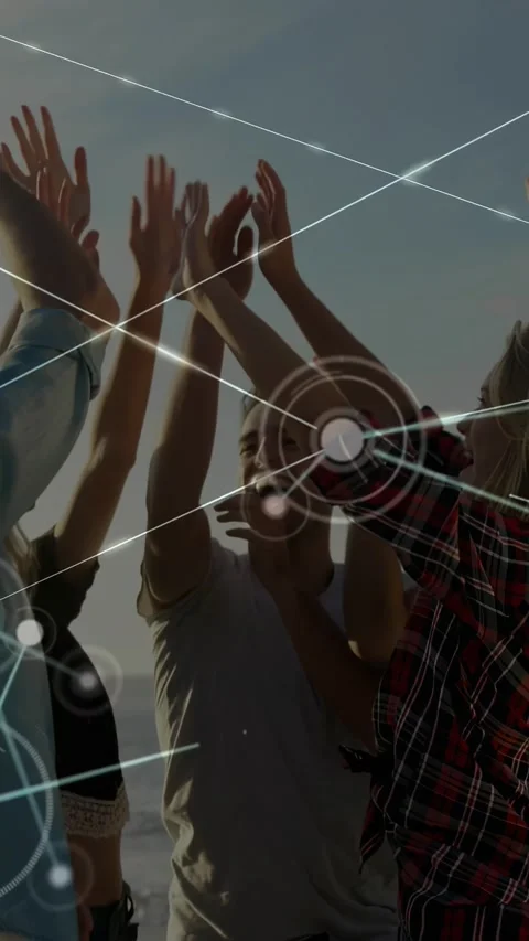 Man clapping, group raising and forming high-five on beach, celebrating as tech Stock Footage 330982302