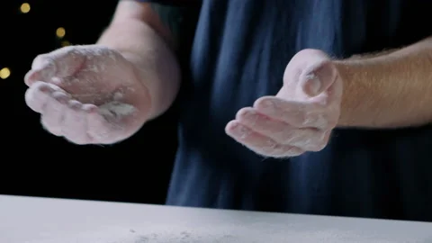 Man clapping hands full of flour Video stock 132798252
