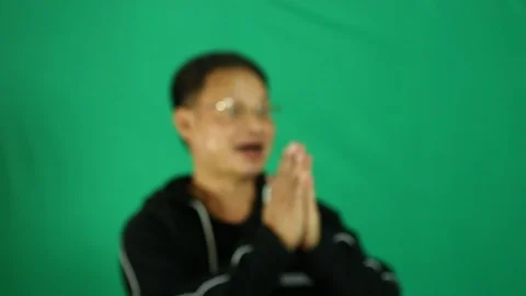 Man clapping hands  with green background  Stock Footage 96314905