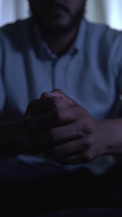 Man clasping hands in increasing despair Video stock 312223479