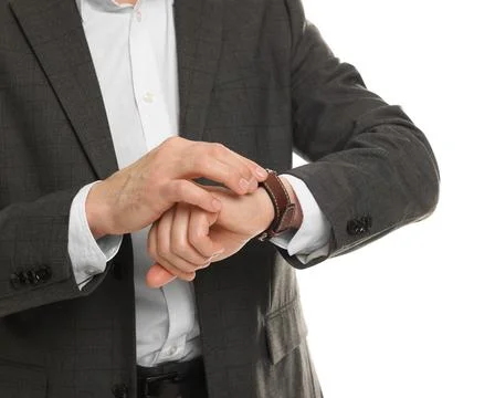 Man in classic suit checking time on white background, closeup Stock Photos