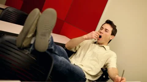 Man in classroom yawning Stock-Footage 10709197