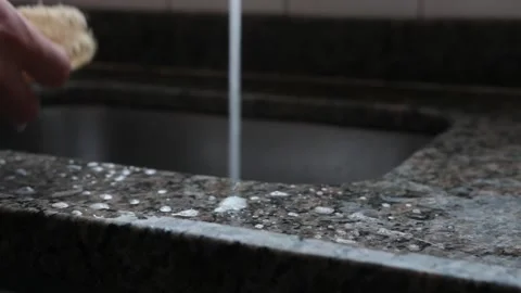 A man clean dishes using a luffa as sponge in a kitchen in Brazil Stock-Footage 145036668