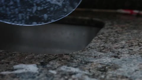 A man clean dishes using a luffa as sponge in a kitchen in Brazil Stock-Footage 145036978