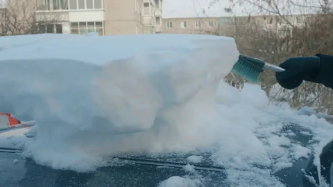 Man clean his car with brush from the snow. Video stock 147575997