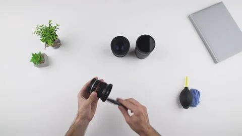 Man clean lens with a soft brush Stock Footage 138055610