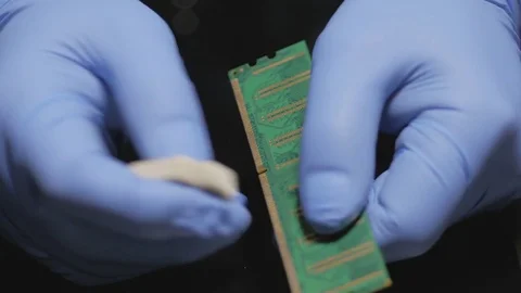 Man clean ram memory with rubber. Wear blue rubber gloves Stock Footage 74118071