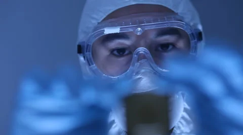 Man in clean room holds up computer cpu microchip Stock Footage 61667785