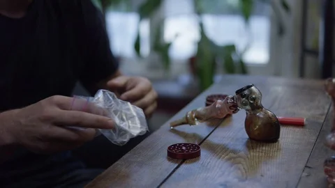 Man cleaning ash from smoking pipe Stock Footage 107954875