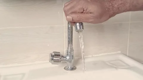 A man cleaning basin in the house Stock Footage 204136007