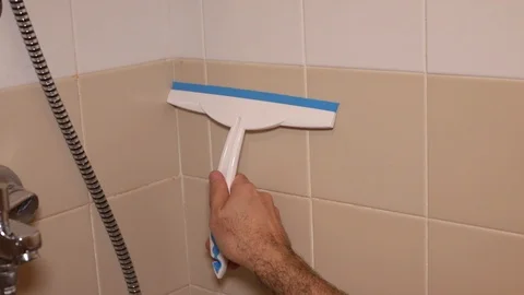 Man cleaning bath wall Video stock 101891219