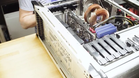 Man cleaning computer system from dust Stock Footage 95943455