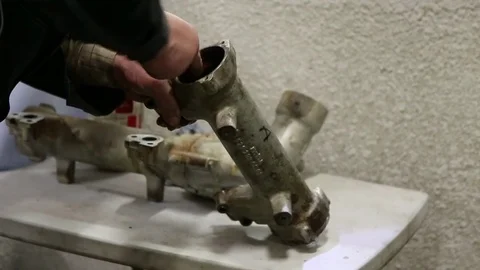 Man cleaning dirty part of the engine system Stock Footage 85241270