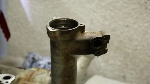 Man cleaning dirty part of the engine system Stock Footage 85241498