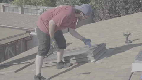 Man Cleaning Dust Off of Rooftop Skylight Window (RAW) Stock Footage 212417476