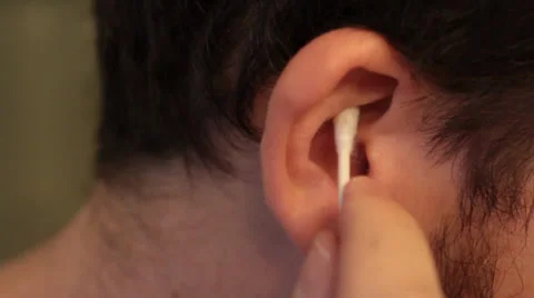 Man Cleaning Ears in Close Up - Q-tip Stock Footage 34480992