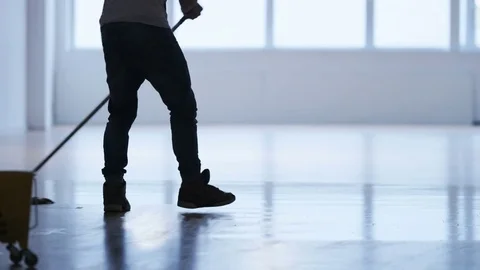 Man Cleaning the Floor in a Gym Stock Footage