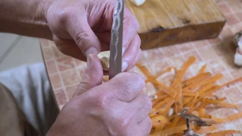 Man is cleaning garlic Stock Footage 80092249